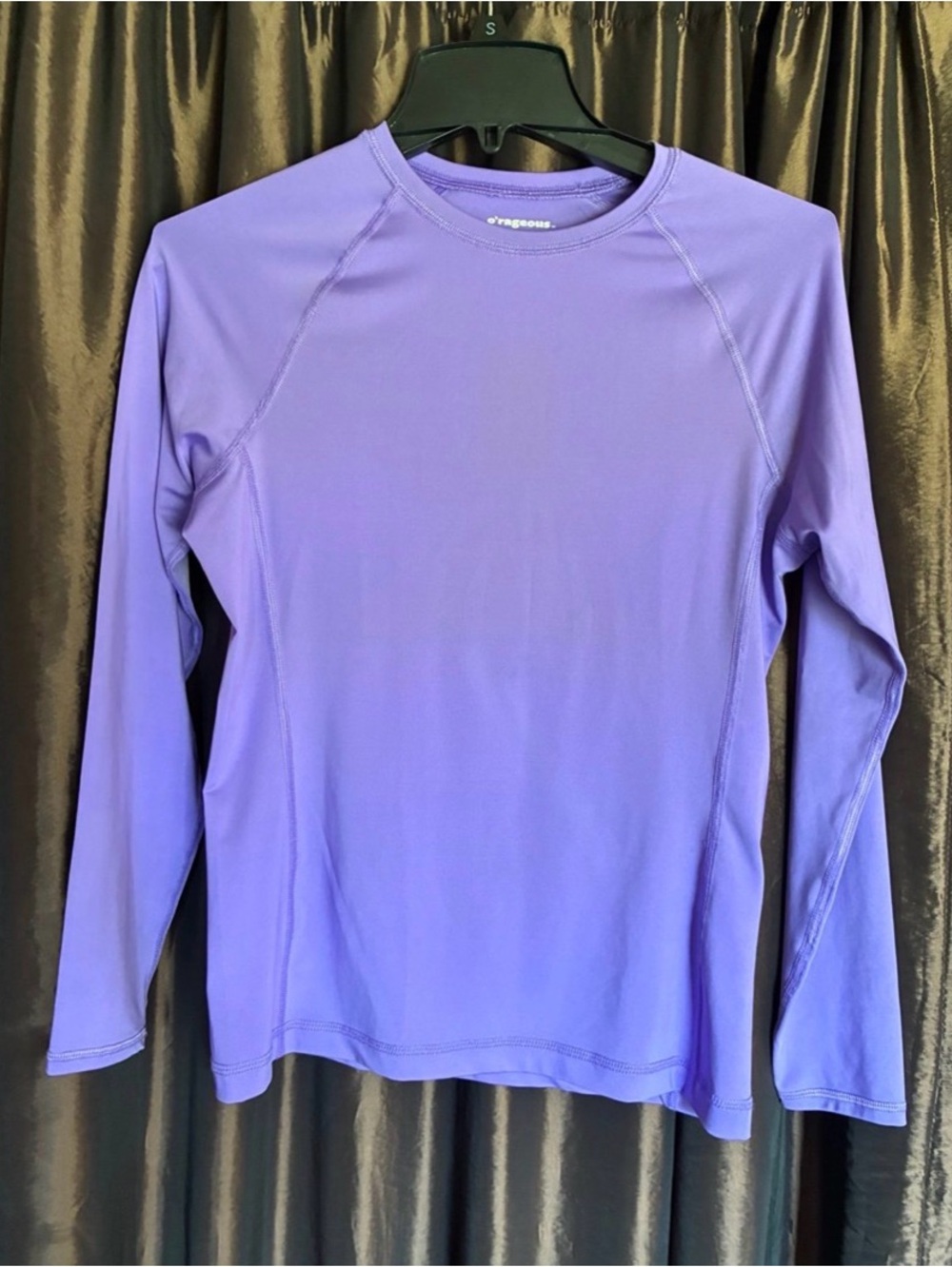 O’rageous brand. Juniors’ L lavender long-sleeved swim shirt.